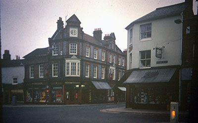 A view taken in the 1960s of WHSmith and Boots on opposite corners at the end of   Duke Street  .    Photo kindly provided by Roy Sadler.  